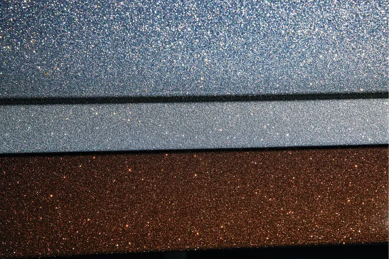 Slide: The Image of Manufacturer Provided Image: Metallic paint finish on 2026 Ranger Z520R Ultra, showcasing glittering silver and bronze hues. - 15