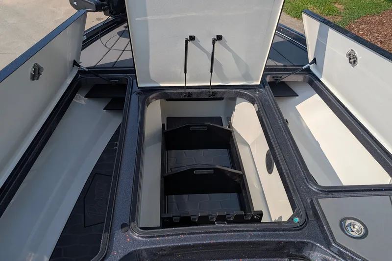 Slide: The Image of 2026 Ranger Z520R Ultra boat storage compartments open, showcasing spacious interior design. - 6