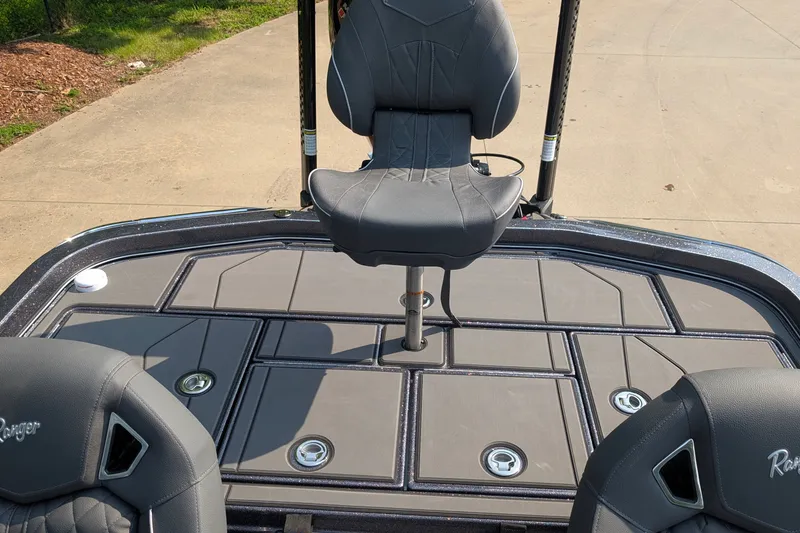 Slide: The Image of 2026 Ranger Z520R Ultra boat deck with seating and storage compartments. - 14