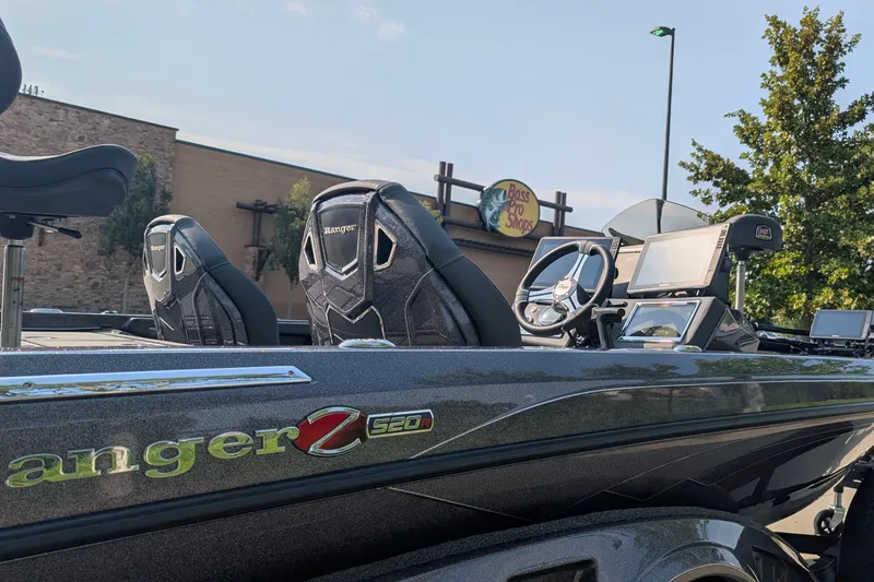 Slide: The Image of 2026 Ranger Z520R Ultra boat at Bass Pro Shops, featuring sleek design and advanced controls. - 2