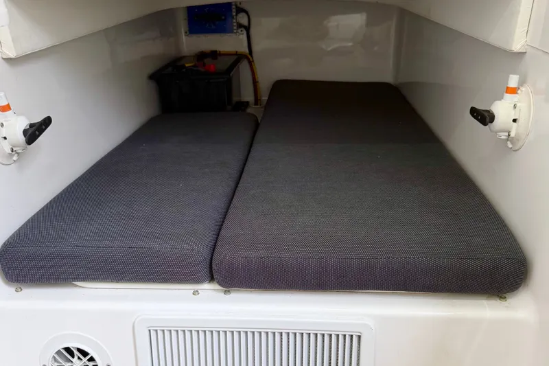 Slide: The Image of Interior cabin of 2025 Front Runner 36 Center Console with cushioned seating. - 20