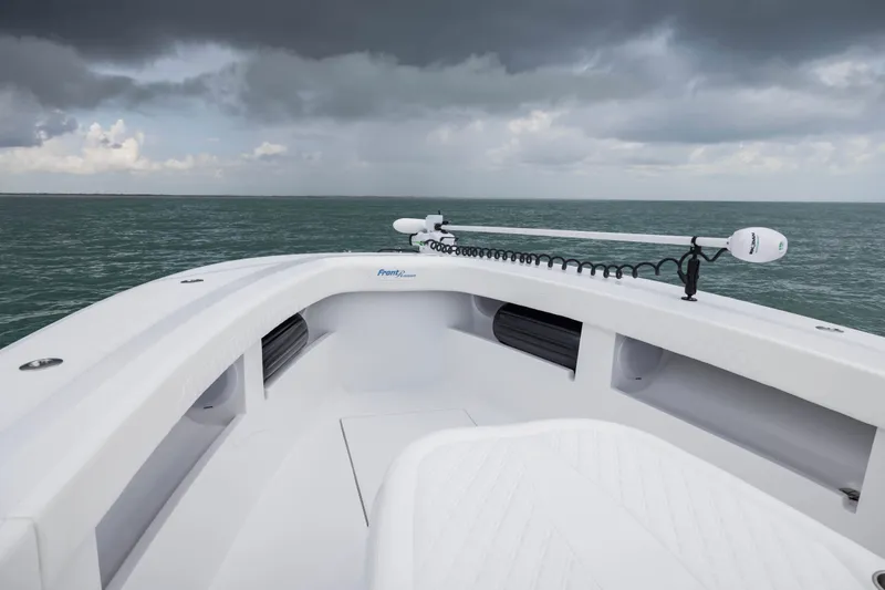 Slide: The Image of 2025 Front Runner 36 Center Console boat on open water under cloudy skies. - 8