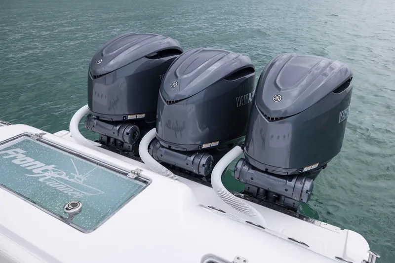 Slide: The Image of Triple Yamaha outboard engines on a 2025 Front Runner 36 Center Console boat. - 11