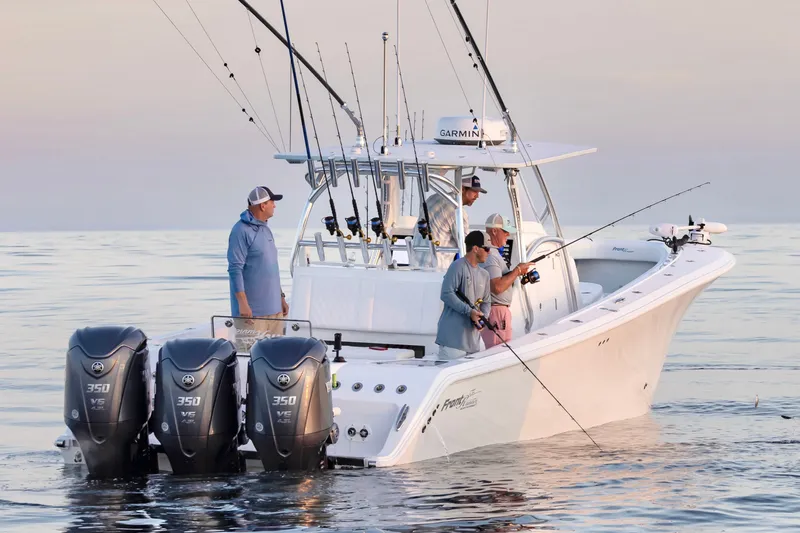 Slide: The Image of 2025 Front Runner 36 Center Console boat with anglers fishing at sea. - 3