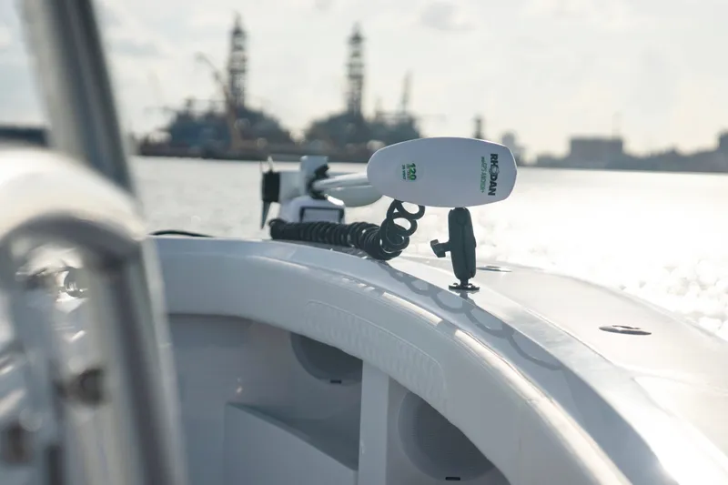 Slide: The Image of 2025 Front Runner 36 Center Console boat with marine equipment, sailing near offshore structures. - 17