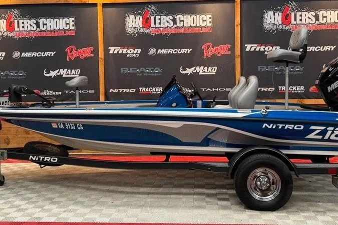 The Image of 2017 Nitro Z18 boat displayed at Anglers Choice showroom with branded backdrop. - 1