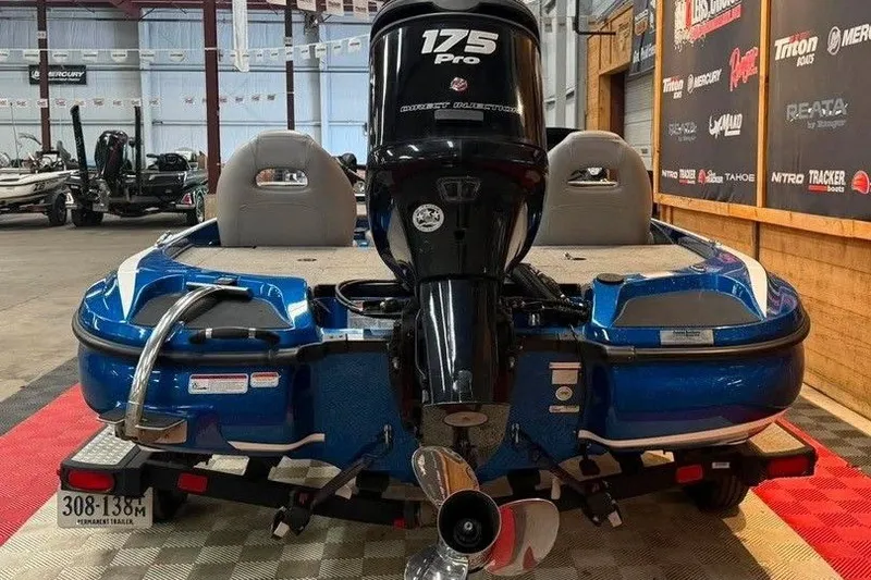 Slide: The Image of Blue 2017 Nitro Z18 boat with 175 Pro motor in showroom setting. - 4