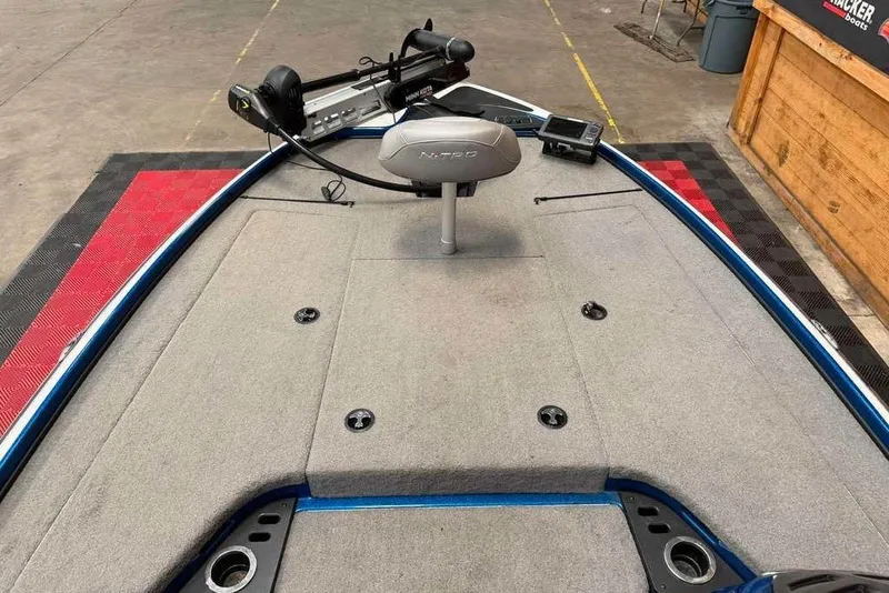 Slide: The Image of 2017 Nitro Z18 boat deck with trolling motor and carpeted surface. - 5