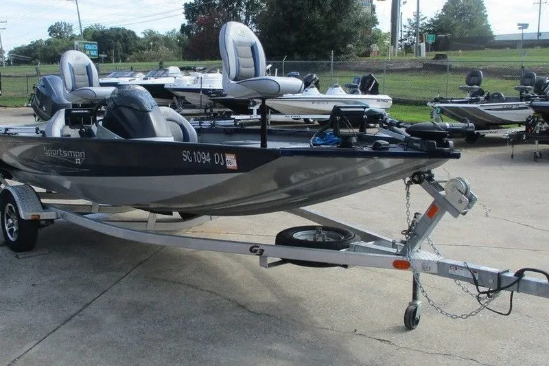 Slide: The Image of 2018 G3 Sportsman 17 fishing boat on trailer, parked outdoors. - 4