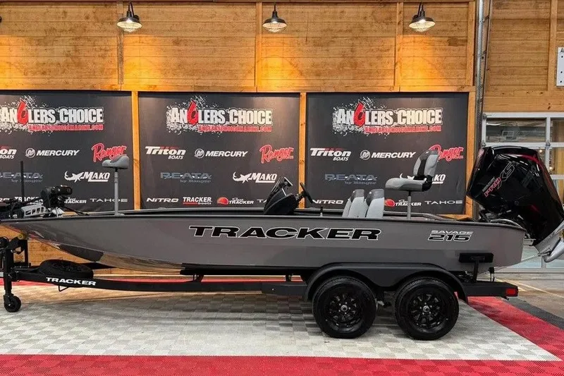 The Image of 2026 Tracker Savage 215 boat displayed at Angler's Choice event indoors. - 1