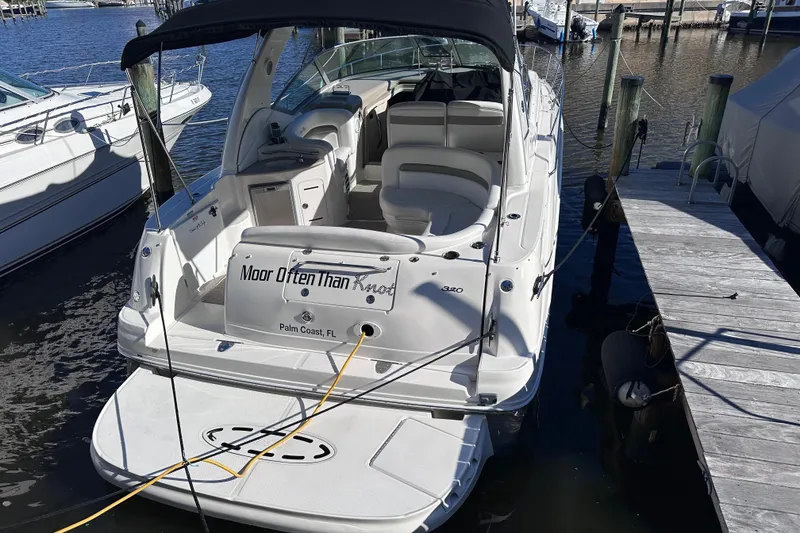 Slide: The Image of 2007 Sea Ray Sundancer 320 docked, featuring spacious seating and sleek design in Palm Coast, FL. - 4