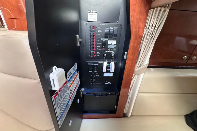 Slide: The Image of Electrical panel inside a 2007 Sea Ray Sundancer 320 boat cabin. - 21