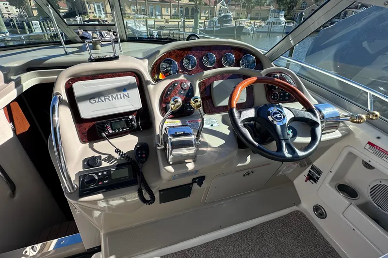 Slide: The Image of Cockpit of 2007 Sea Ray Sundancer 320 with Garmin navigation system and steering wheel. - 7