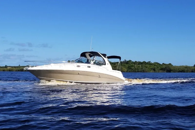Slide: The Image of 2007 Sea Ray Sundancer 320 cruising on a sunny day with clear blue skies. - 1