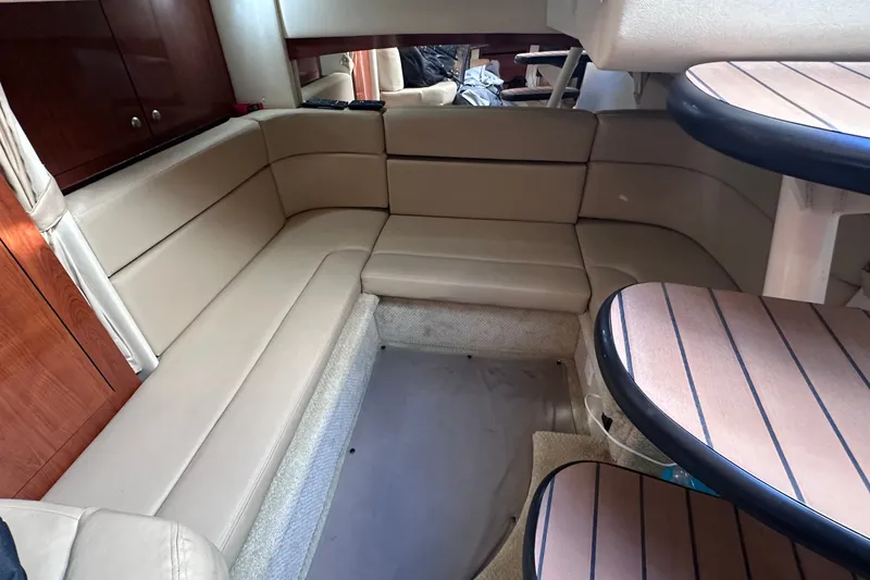 Slide: The Image of Interior of 2007 Sea Ray Sundancer 320 with beige seating and wooden accents. - 16