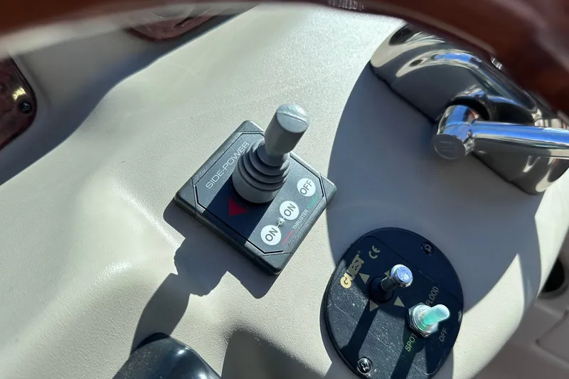 Slide: The Image of Control panel of a 2007 Sea Ray Sundancer 320 boat, featuring Side-Power thruster controls. - 9