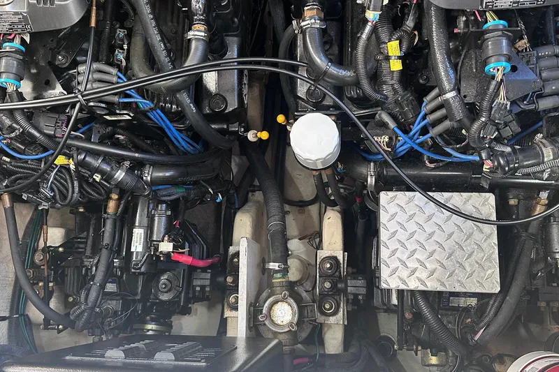 Slide: The Image of Engine compartment of a 2007 Sea Ray Sundancer 320, showcasing intricate wiring and components. - 28