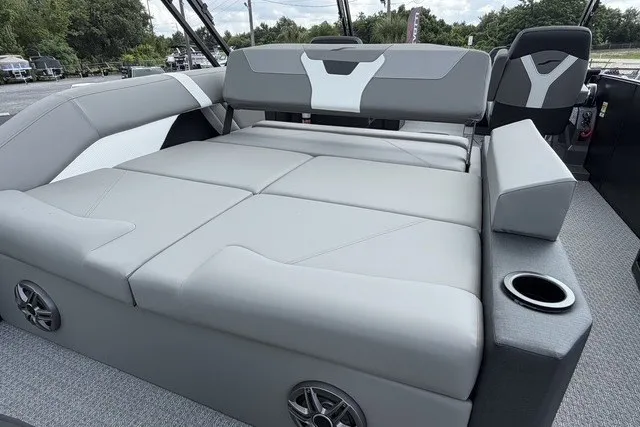 Slide: The Image of Luxurious seating area on 2027 Evotti 523CS boat with gray upholstery and cup holder. - 18