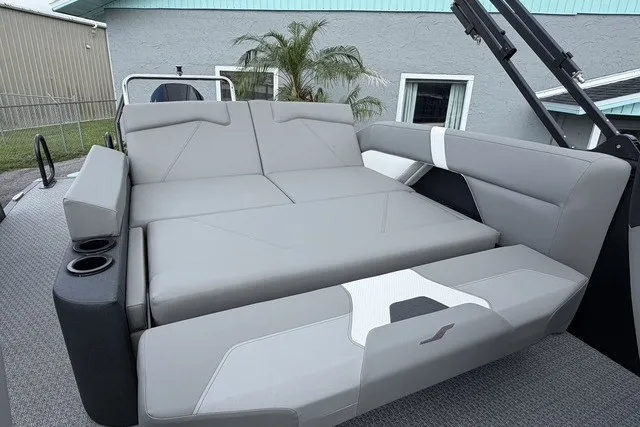 Slide: The Image of Luxurious seating on 2027 Evotti 523CS boat, featuring sleek gray upholstery and cup holders. - 19