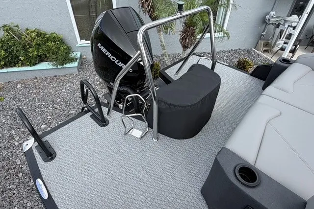 Slide: The Image of 2027 Evotti 523CS boat deck with Mercury engine, featuring sleek design and modern seating. - 16