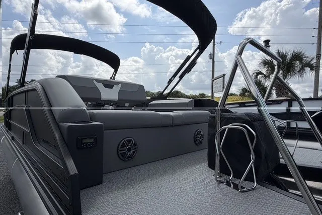 Slide: The Image of Luxury Evotti 523CS pontoon boat, 2027 model, featuring sleek seating and modern design. - 12