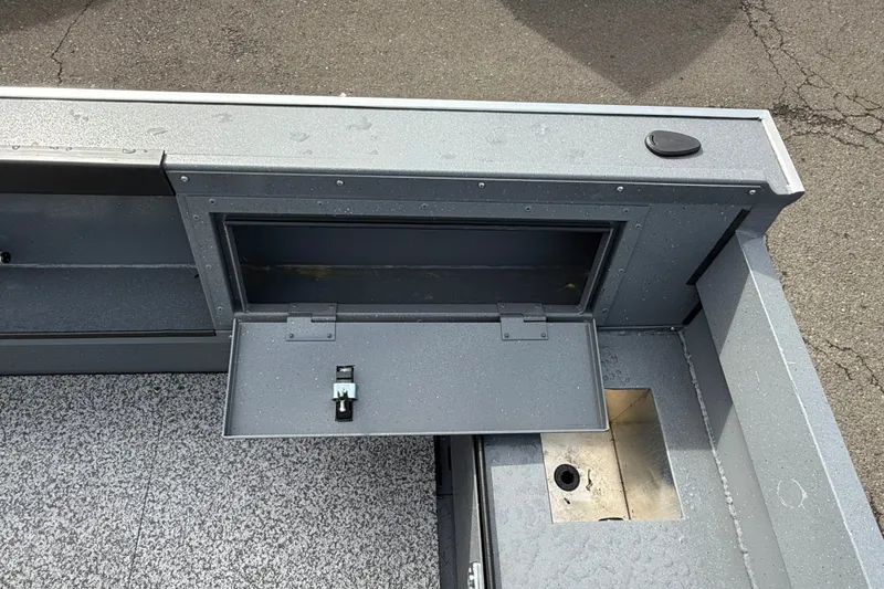 Slide: The Image of 2027 Alumaweld Free Drifter 18 boat interior with open storage compartment. - 20