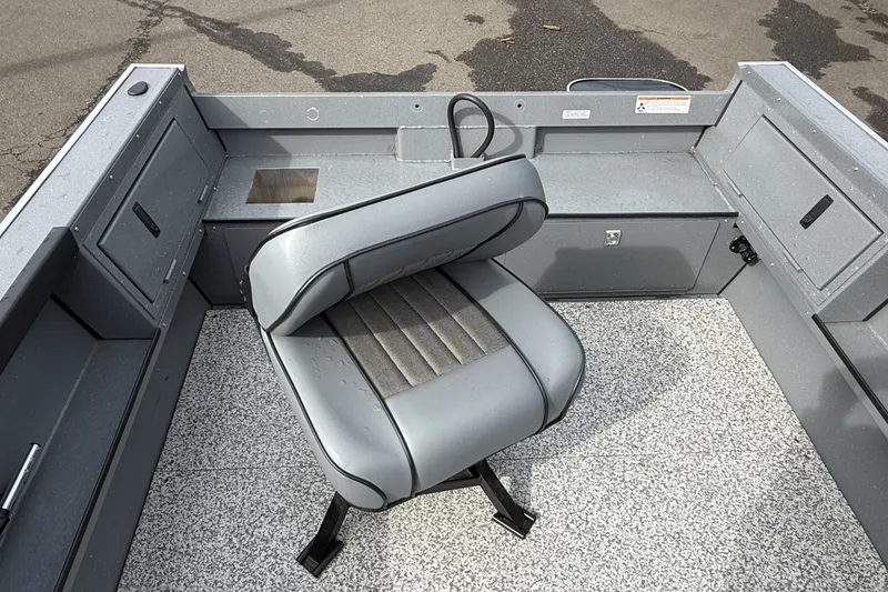 Slide: The Image of Interior of 2027 Alumaweld Free Drifter 18 boat with gray seating and storage compartments. - 16
