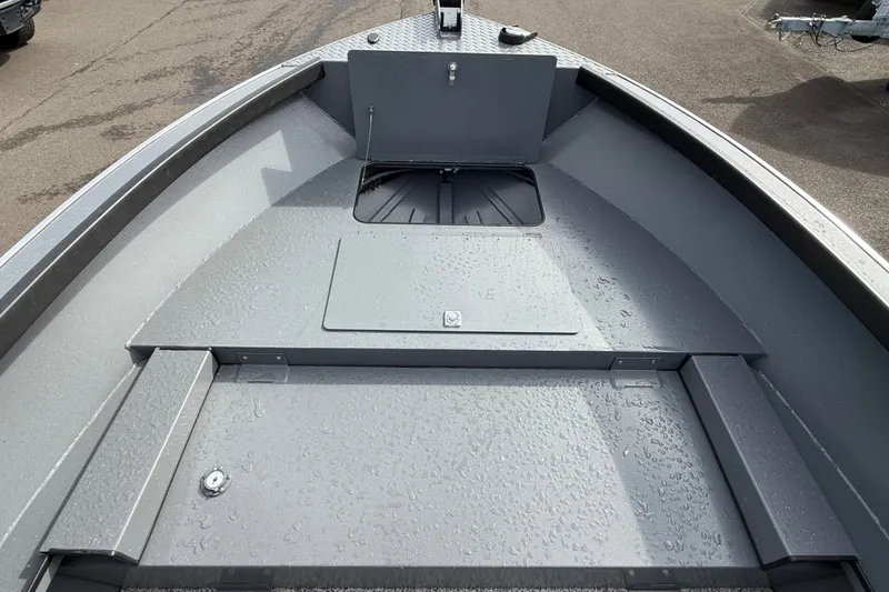 Slide: The Image of Alumaweld Free Drifter 18 boat deck, 2027 model, with storage compartments and sleek design. - 12