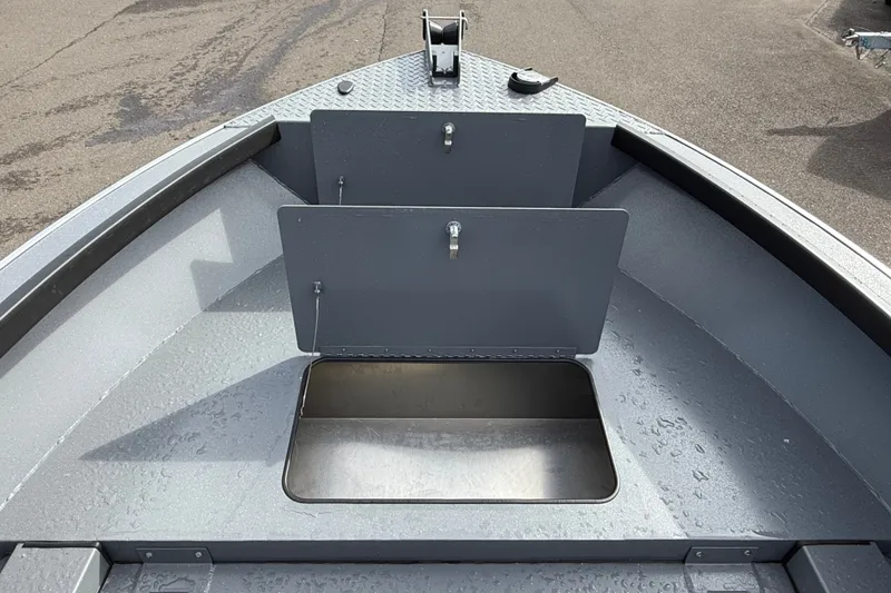 Slide: The Image of 2027 Alumaweld Free Drifter 18 boat interior with open storage compartment. - 13