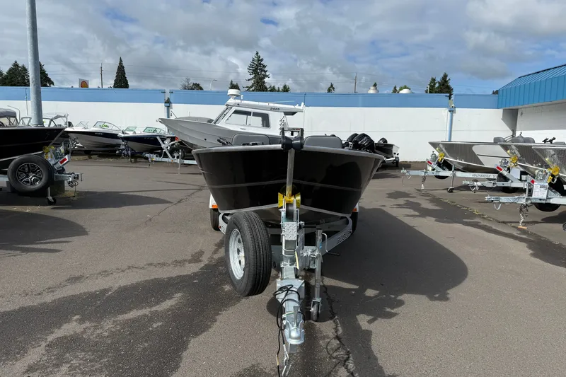 Slide: The Image of 2027 Alumaweld Free Drifter 18 boat on trailer in outdoor lot. - 2