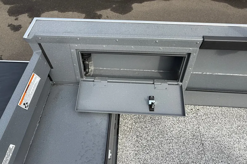 Slide: The Image of 2027 Alumaweld Free Drifter 18 boat storage compartment with open hatch and latch. - 18
