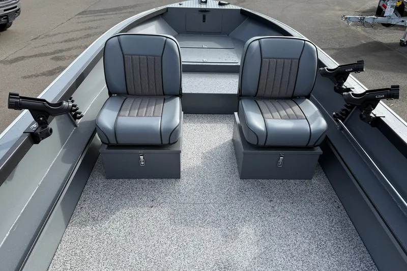 Slide: The Image of 2027 Alumaweld Free Drifter 18 interior with two gray seats and rod holders. - 10