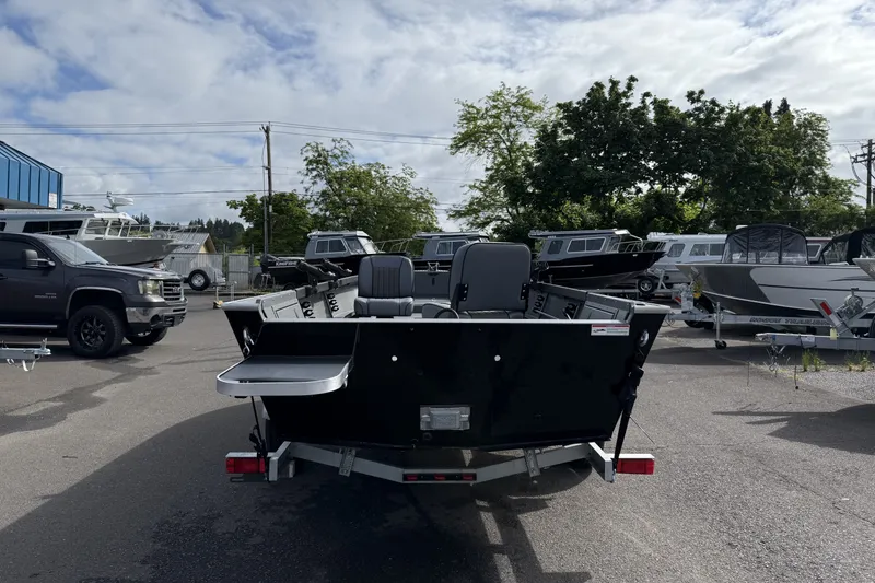 Slide: The Image of 2027 Alumaweld Free Drifter 18 boat on trailer in outdoor lot. - 3
