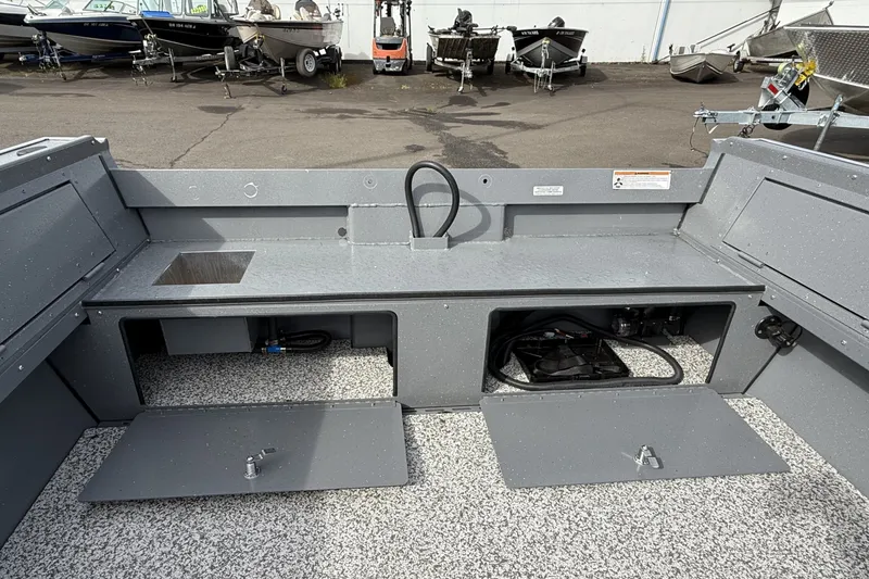 Slide: The Image of 2027 Alumaweld Free Drifter 18 boat interior with storage compartments and sink. - 21