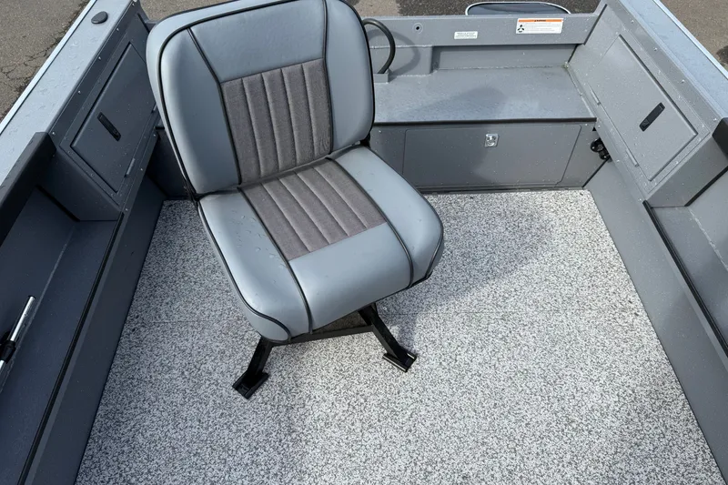 Slide: The Image of 2027 Alumaweld Free Drifter 18 interior with gray seating and textured flooring. - 8
