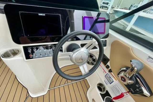 Slide: The Image of 2025 Sea Ray SDX 270 helm with modern controls and navigation displays. - 4