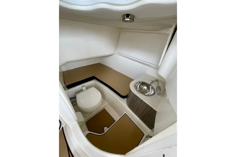 Slide: The Image of Interior cabin of 2025 Sea Ray SDX 270 boat with toilet and sink. - 5