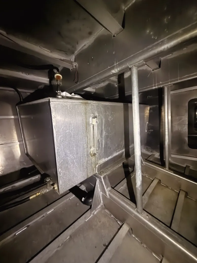 Slide: The Image of Interior view of an aluminum boat with structural reinforcements and a rectangular metal tank. - 10