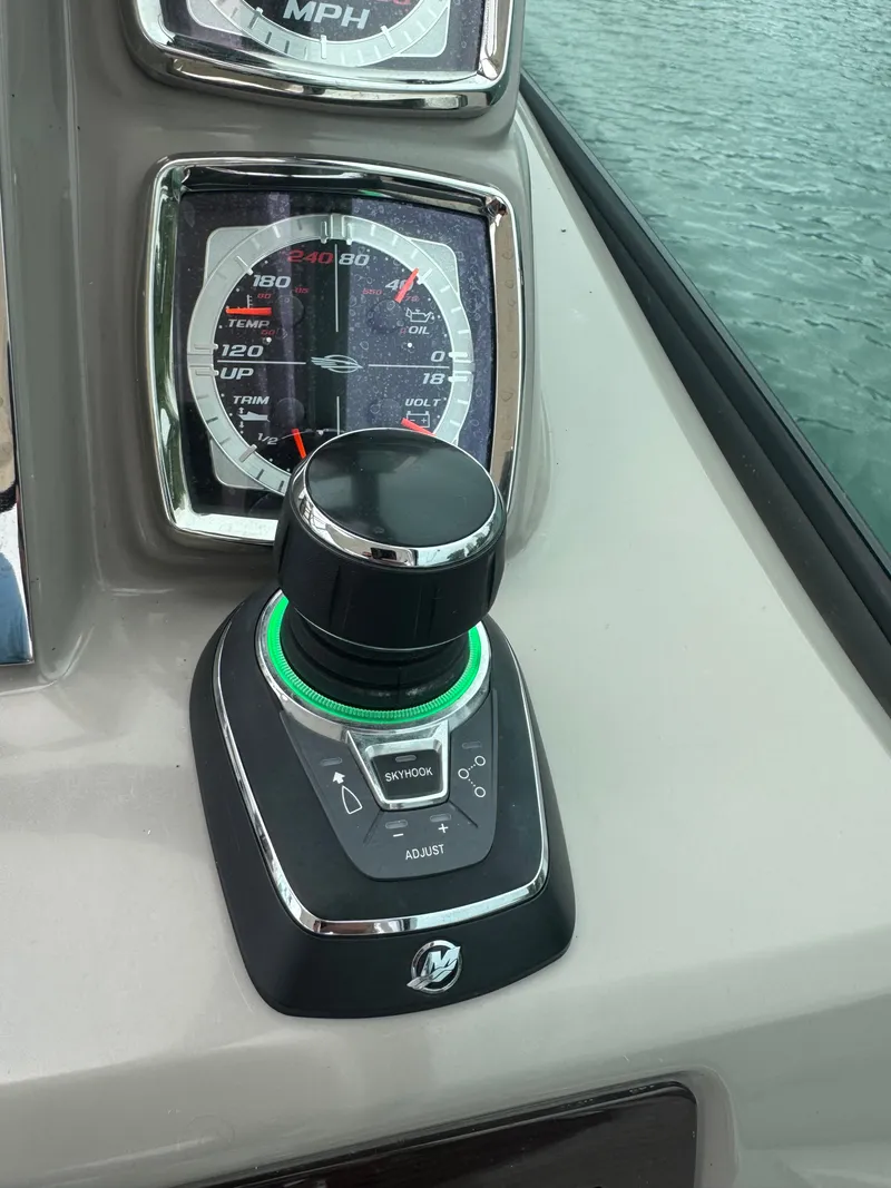 Slide: The Image of Close-up of a joystick and speedometer on a Chaparral 330 Signature boat. - 10