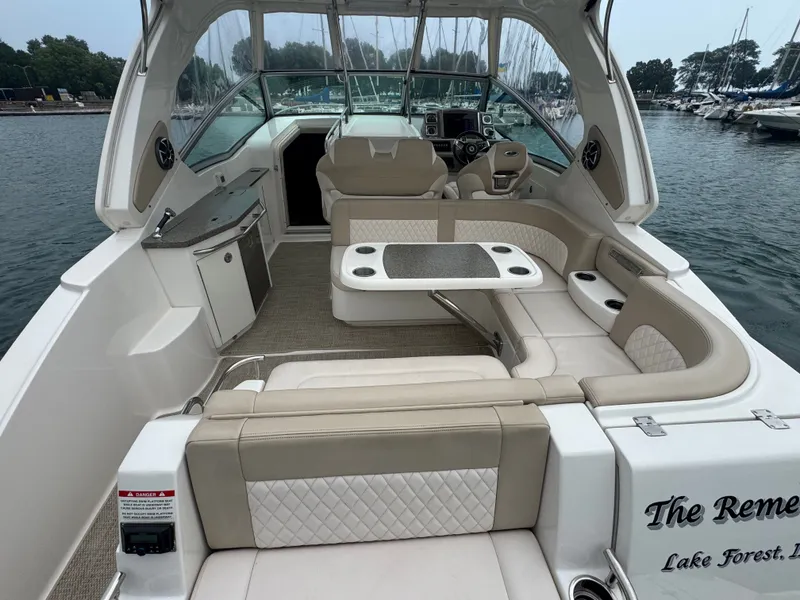 Slide: The Image of The image shows the cockpit of a 2018 Chaparral 330 Signature with beige upholstery. - 4
