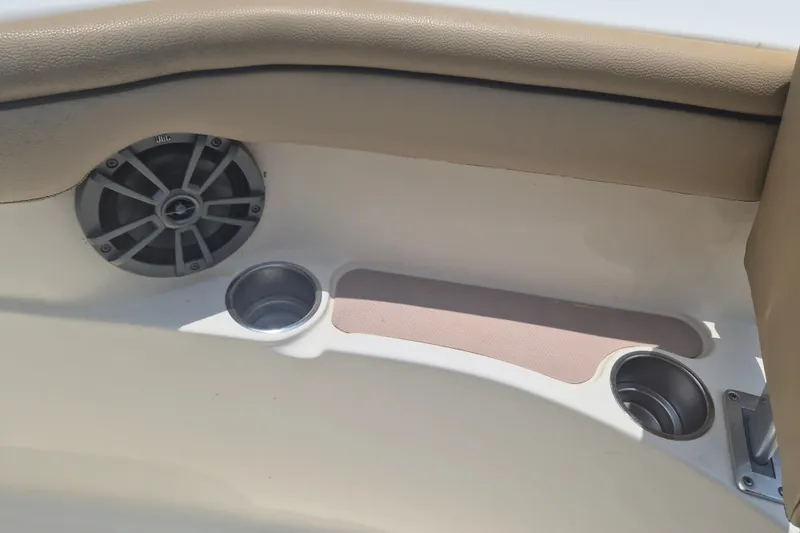 Slide: The Image of 2017 Scout 215 XSF boat interior with speaker and cup holders. - 22