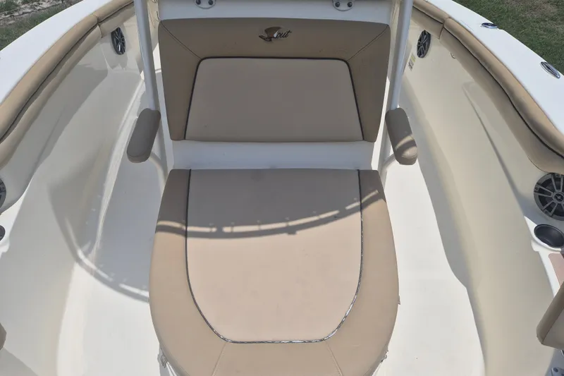 Slide: The Image of 2017 Scout 215 XSF boat interior with beige seating and armrests. - 23