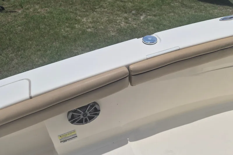 Slide: The Image of 2017 Scout 215 XSF boat interior with cushioned seating and speaker detail. - 18