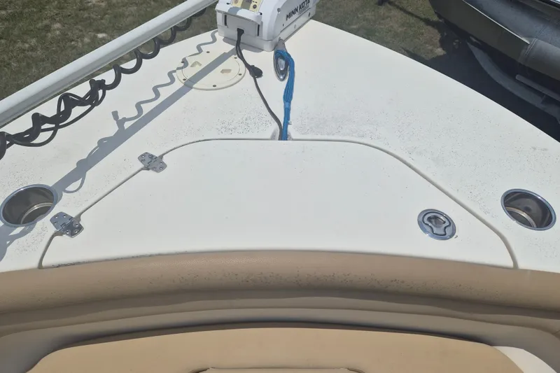 Slide: The Image of 2017 Scout 215 XSF boat deck with mounted equipment and cup holders. - 27
