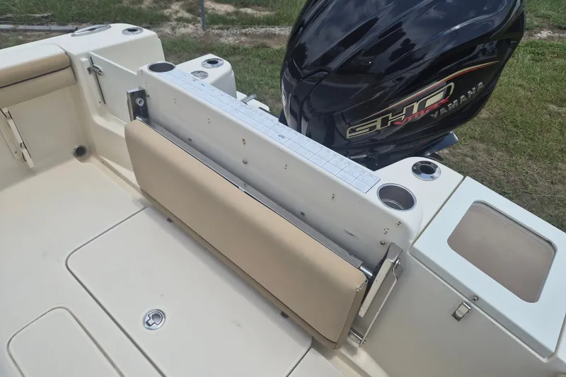Slide: The Image of 2017 Scout 215 XSF boat interior with Yamaha engine, featuring seating and storage compartments. - 10