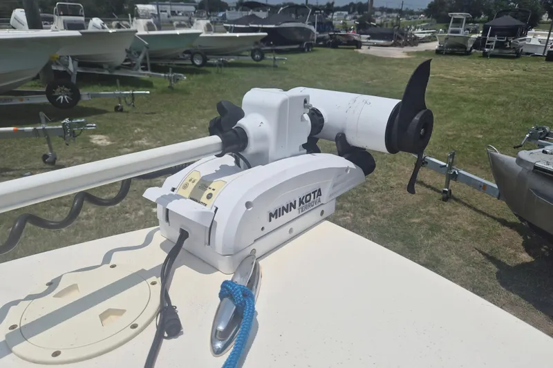 Slide: The Image of Minn Kota Terrova trolling motor on 2017 Scout 215 XSF boat, parked on grassy lot. - 29