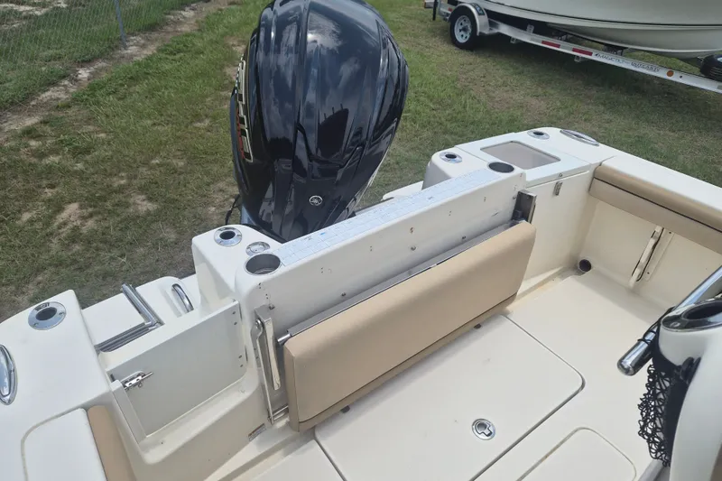 Slide: The Image of 2017 Scout 215 XSF boat interior with seating and outboard motor. - 7