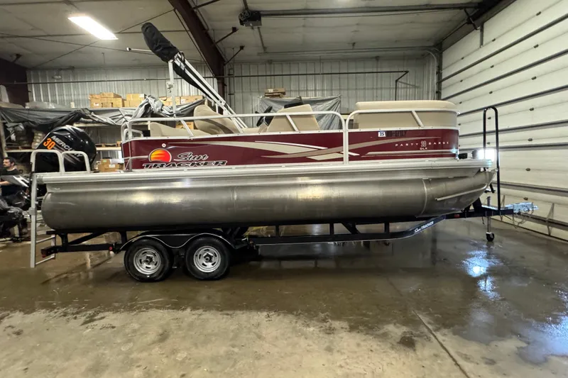 The Image of 2014 Sun Tracker Party Barge 20 DLX pontoon boat in a garage setting. - 0