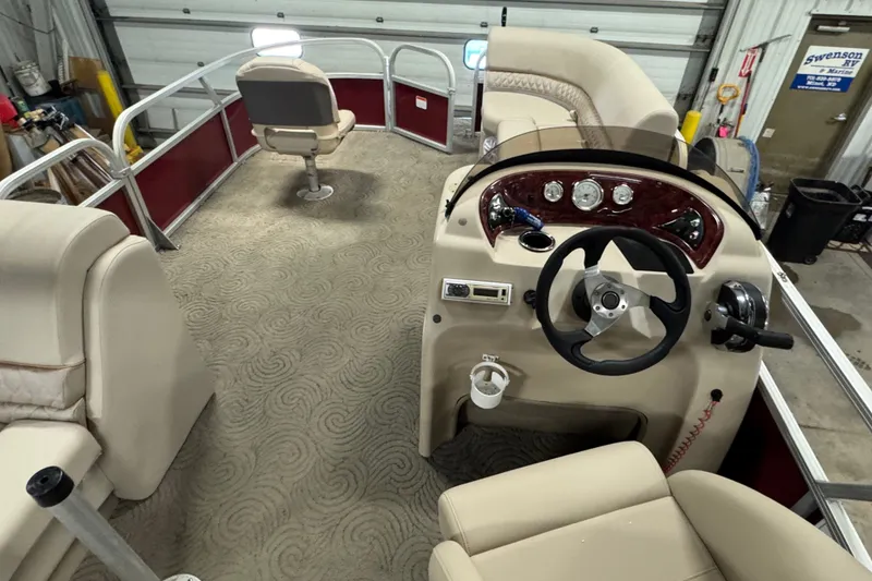 Slide: The Image of 2014 Sun Tracker Party Barge 20 DLX interior with steering console and seating. - 13