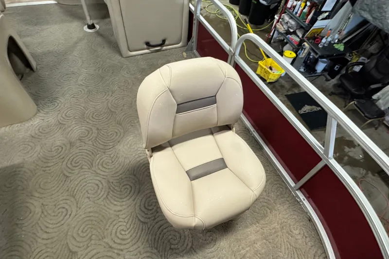 Slide: The Image of Beige seat on 2014 Sun Tracker Party Barge 20 DLX pontoon boat, with patterned carpet. - 5